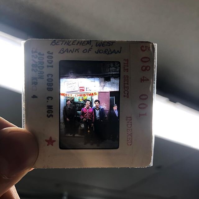35mm slide of a Bethlehem shop with a Merry Christmas banner, 1982.